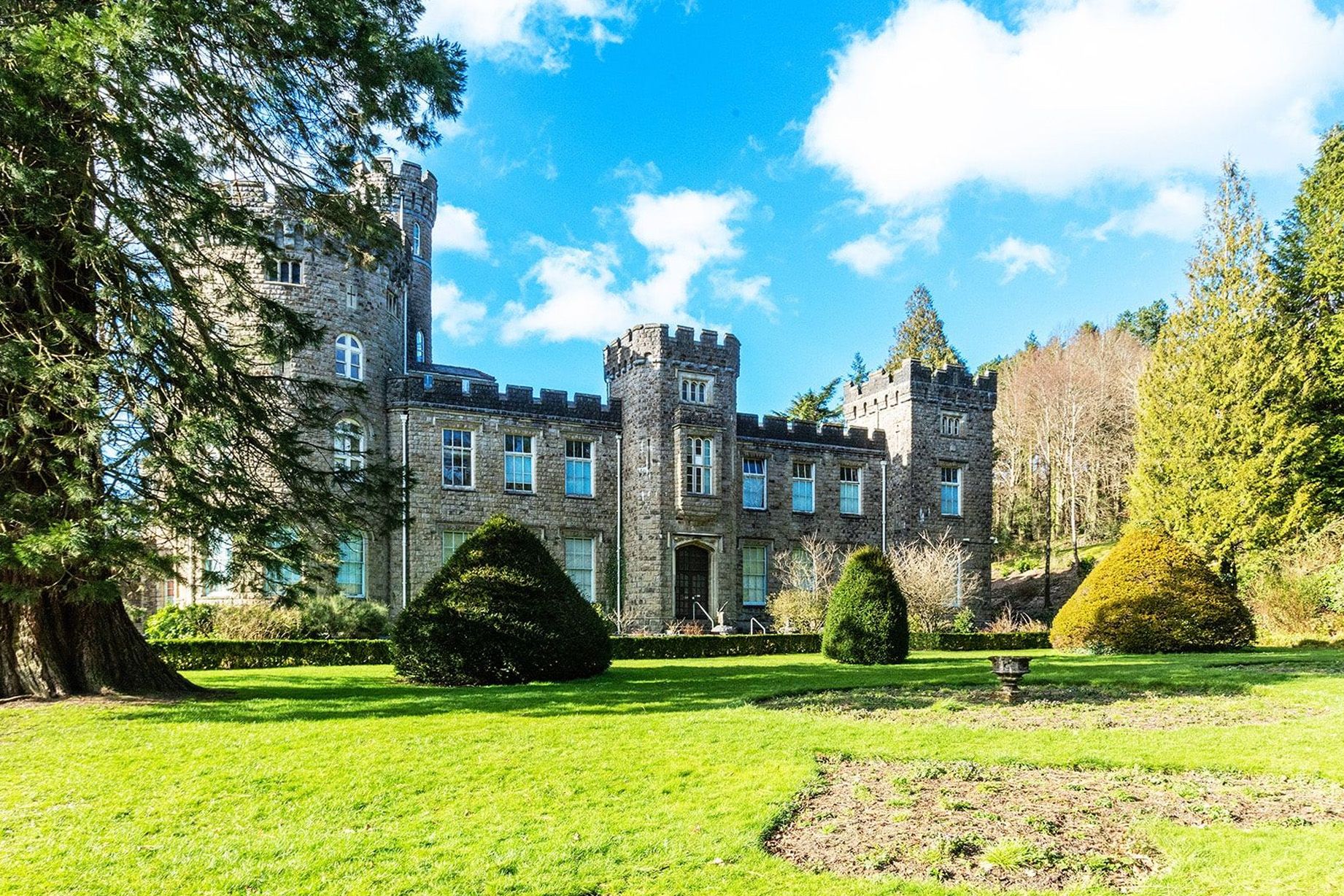 Cyfarthfa Castle with grass garden and blue sky.jpg